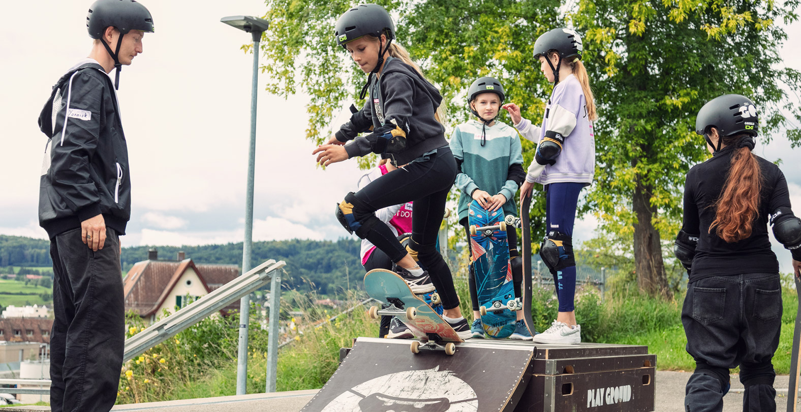 Gorilla school program. Teaching kids how to skateboard