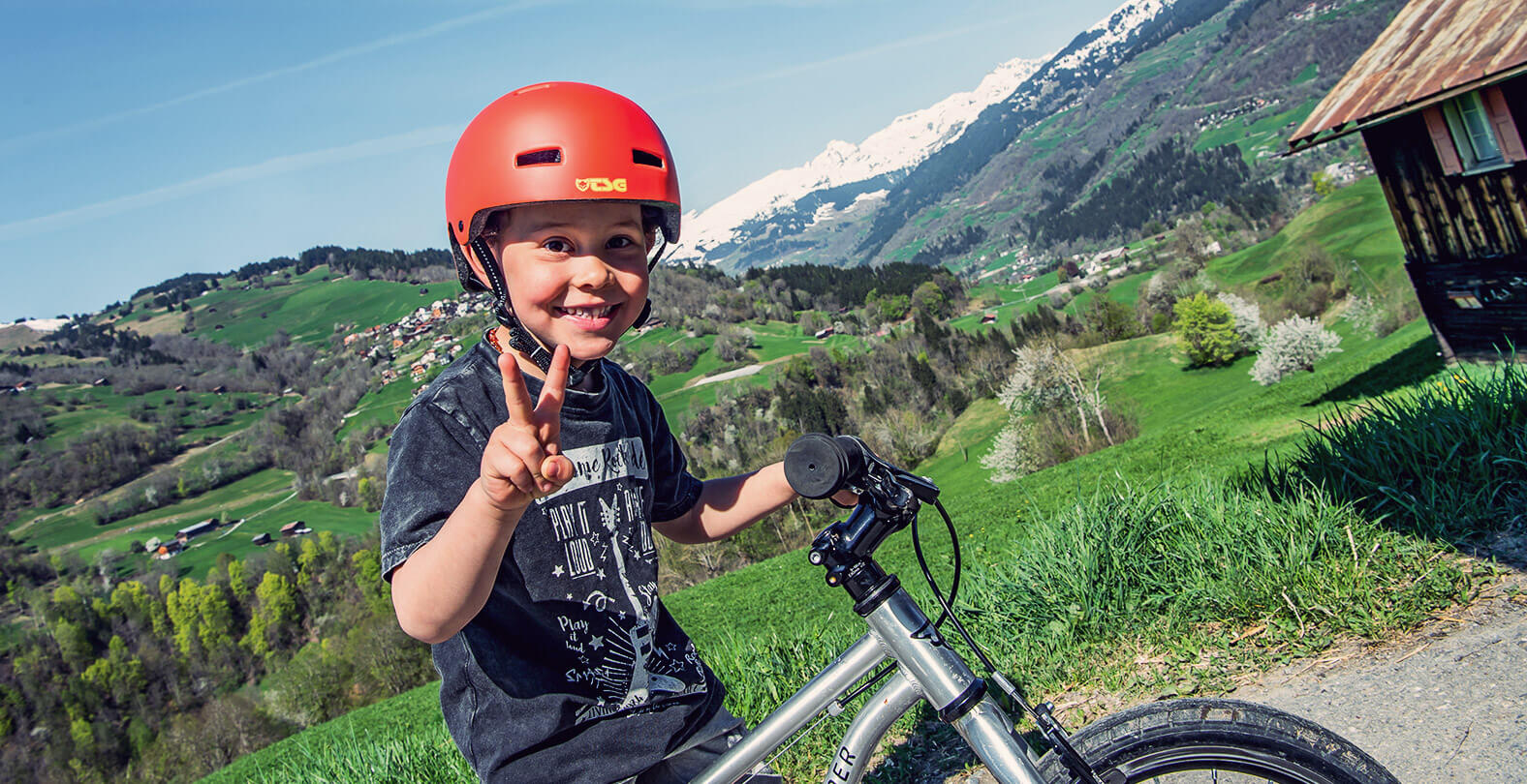 Happy biking kid with helmet