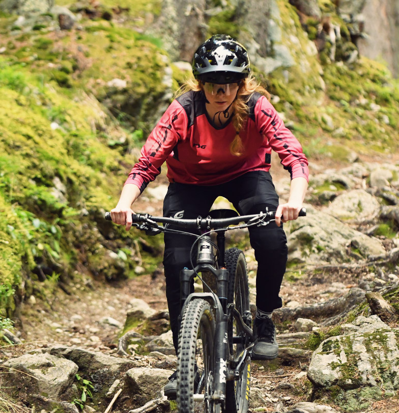 Mountain biking women on the trail with TSG products