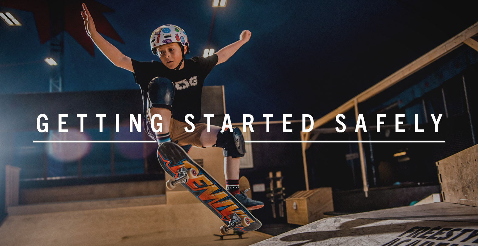 Skateboarder with helmet and pads
